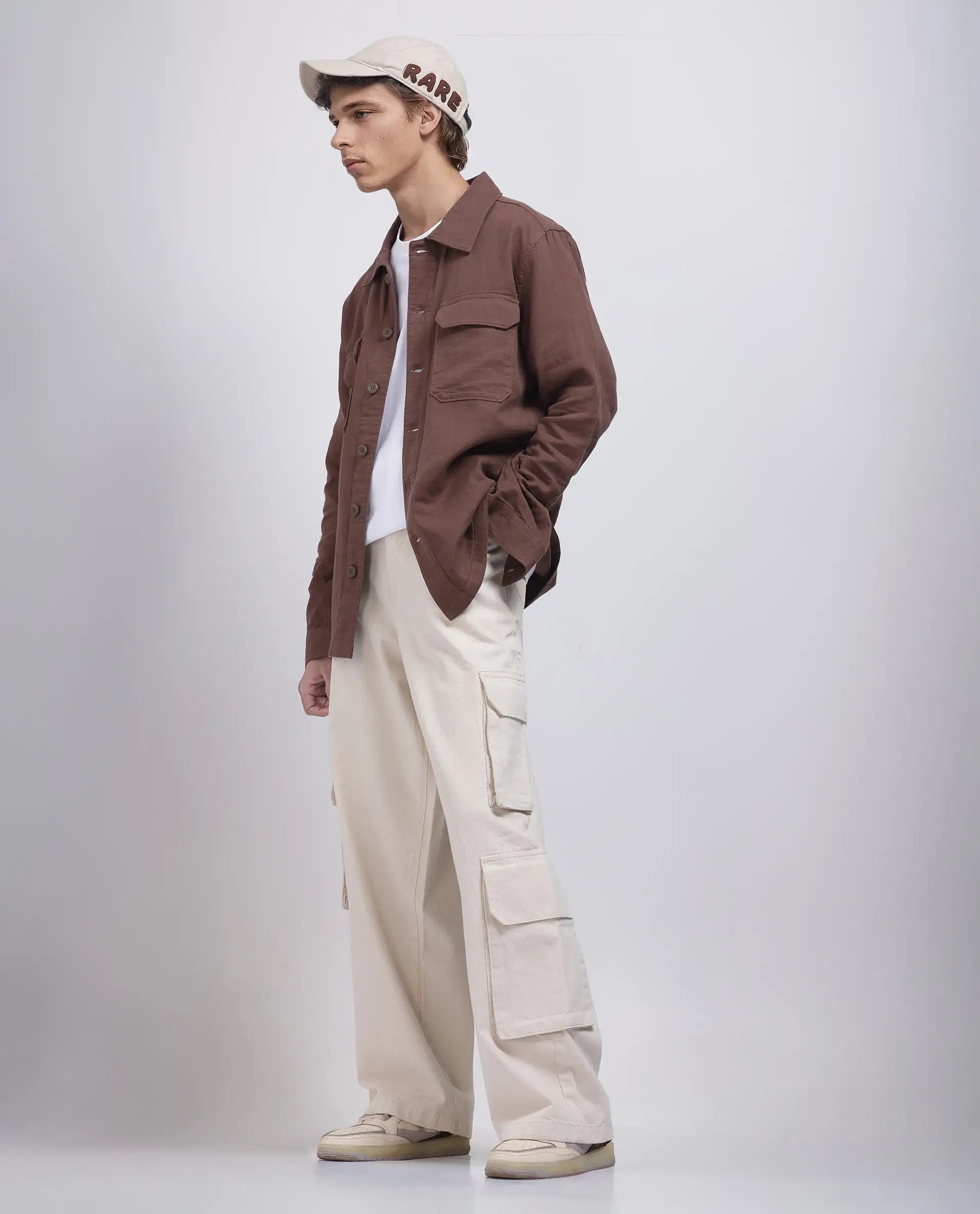 Dark Wash Men's JeansRare Rabbit Men's Freks Beige Cotton Fabric Button And Zip Closure Baggy Fit Plain Jeans Dark Wash Men's JeansRare Rabbit Men's Freks Beige Cotton Fabric Button And Zip Closure Baggy Fit Plain Jeans